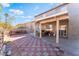 Checkered patio with a covered seating area at 8600 Copper Falls Ave, Las Vegas, NV 89129