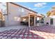 Large backyard with patio, shed, and checkerboard tile at 8600 Copper Falls Ave, Las Vegas, NV 89129