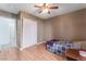 Bright bedroom with ceiling fan and wood flooring at 8600 Copper Falls Ave, Las Vegas, NV 89129