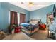 Bedroom with a queen-size bed and large bookshelf at 8600 Copper Falls Ave, Las Vegas, NV 89129