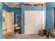 Spacious bedroom with double doors leading to a large closet at 8600 Copper Falls Ave, Las Vegas, NV 89129