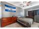 Bedroom with dresser, ceiling fan, and El Salvador flag at 8600 Copper Falls Ave, Las Vegas, NV 89129