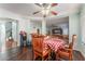 Cozy breakfast nook with red and white checkered tablecloth and wood chairs at 8600 Copper Falls Ave, Las Vegas, NV 89129