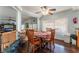 Small breakfast nook with a checkered tablecloth and wooden chairs at 8600 Copper Falls Ave, Las Vegas, NV 89129