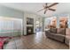 Living room with fireplace, tiled floors and view of kitchen at 8600 Copper Falls Ave, Las Vegas, NV 89129