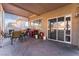 Covered patio with seating area, and access to backyard at 8600 Copper Falls Ave, Las Vegas, NV 89129