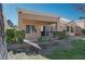 Private backyard with covered patio and grassy area at 8608 Millsboro Dr, Las Vegas, NV 89134