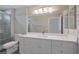 Bathroom with white vanity, quartz countertop and a walk-in shower at 8608 Millsboro Dr, Las Vegas, NV 89134