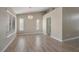 Bright dining room features light walls, wood-look floors, and a chandelier at 8608 Millsboro Dr, Las Vegas, NV 89134