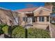 Home exterior showcasing a patio area with landscaping at 8608 Millsboro Dr, Las Vegas, NV 89134