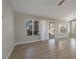 Living room with hardwood floors, large windows and sliding glass doors at 8608 Millsboro Dr, Las Vegas, NV 89134