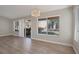 Living area with hardwood floors, a chandelier, and large windows at 8608 Millsboro Dr, Las Vegas, NV 89134