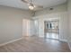 Spacious main bedroom with mirrored closet doors and wood-look floors at 8608 Millsboro Dr, Las Vegas, NV 89134