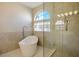 Elegant bathroom with soaking tub, glass shower, and updated fixtures at 8896 Dove Cove Dr, Las Vegas, NV 89129