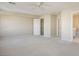 Spacious bedroom with neutral carpeting and ample closet space at 8896 Dove Cove Dr, Las Vegas, NV 89129