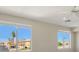 Bright bedroom with two windows and a view of the neighborhood at 8896 Dove Cove Dr, Las Vegas, NV 89129