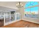 Dining area with hardwood floors, chandelier, and view of the pool at 8896 Dove Cove Dr, Las Vegas, NV 89129