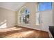 Living room with hardwood floors and large windows at 8896 Dove Cove Dr, Las Vegas, NV 89129