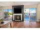 Living room with fireplace, hardwood floors and sliding doors to backyard at 8896 Dove Cove Dr, Las Vegas, NV 89129