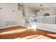 Bright and airy living room with hardwood floors and staircase at 8896 Dove Cove Dr, Las Vegas, NV 89129