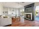 Living room with fireplace, built-in shelving, and hardwood floors at 8896 Dove Cove Dr, Las Vegas, NV 89129