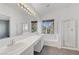 Elegant bathroom with dual vanities, a tub, and a separate shower at 9104 Little Horse Ave, Las Vegas, NV 89143