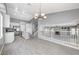 Open concept kitchen with an island, white cabinets, and stainless steel appliances at 9104 Little Horse Ave, Las Vegas, NV 89143