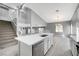 Open concept kitchen and dining area with modern island at 9104 Little Horse Ave, Las Vegas, NV 89143