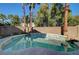 Relaxing kidney-shaped pool in sunny backyard at 9104 Little Horse Ave, Las Vegas, NV 89143