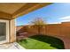 Small backyard with artificial turf and a block wall at 9279 Cabin Cove Ave, Las Vegas, NV 89148