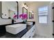 Modern bathroom with double vanity and black matte fixtures at 9279 Cabin Cove Ave, Las Vegas, NV 89148