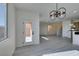 Bright dining area with view of backyard and kitchen, showcasing wood-look floors at 9279 Cabin Cove Ave, Las Vegas, NV 89148