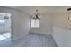 Bright dining room features hardwood floors and a modern chandelier at 9279 Cabin Cove Ave, Las Vegas, NV 89148