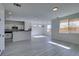 Open concept kitchen with white cabinets and a breakfast bar at 9279 Cabin Cove Ave, Las Vegas, NV 89148