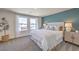 Main bedroom with a king-size bed, neutral decor, and large windows at 9315 Jade Mesa St # Lot 62, Las Vegas, NV 89139