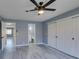 Bright bedroom with ceiling fan, large closet, and access to bathroom at 936 Boulder Mesa Dr # 201, Las Vegas, NV 89128