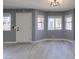 Bright entryway with new flooring and modern light fixture at 936 Boulder Mesa Dr # 201, Las Vegas, NV 89128