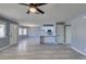 Bright living room with kitchen and wood-look floors at 936 Boulder Mesa Dr # 201, Las Vegas, NV 89128