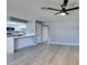 Spacious living room with grey walls, wood-look floors, and ceiling fan at 936 Boulder Mesa Dr # 201, Las Vegas, NV 89128