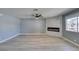 Living room featuring a modern fireplace and ceiling fan at 936 Boulder Mesa Dr # 201, Las Vegas, NV 89128