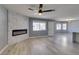 Living room featuring a modern fireplace and ceiling fan at 936 Boulder Mesa Dr # 201, Las Vegas, NV 89128