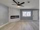 Living room featuring a modern fireplace and ceiling fan at 936 Boulder Mesa Dr # 201, Las Vegas, NV 89128