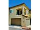 Modern two-story home with a one-car garage and a small balcony at 965 Nevada State Dr # 1202, Henderson, NV 89002