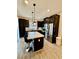 Modern kitchen with stainless steel appliances and a breakfast bar island at 965 Nevada State Dr # 1202, Henderson, NV 89002