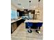 Modern kitchen boasts an island with bar seating and stainless steel appliances at 965 Nevada State Dr # 1202, Henderson, NV 89002