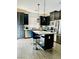 Modern kitchen with dark cabinetry and an island at 965 Nevada State Dr # 1202, Henderson, NV 89002