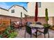 Private backyard patio with seating area, umbrellas, and landscaping at 9916 Fallowdeer Ct, Las Vegas, NV 89149