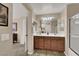 Double vanity bathroom with a large shower and a view into the bedroom at 9916 Fallowdeer Ct, Las Vegas, NV 89149