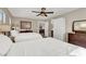 Bright bedroom with two twin beds, dresser, and ceiling fan at 9916 Fallowdeer Ct, Las Vegas, NV 89149