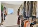 Large walk-in closet with ample hanging space and shelving at 9916 Fallowdeer Ct, Las Vegas, NV 89149